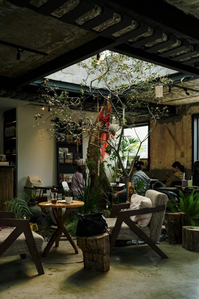 Cafe interior with a tree and sunlight